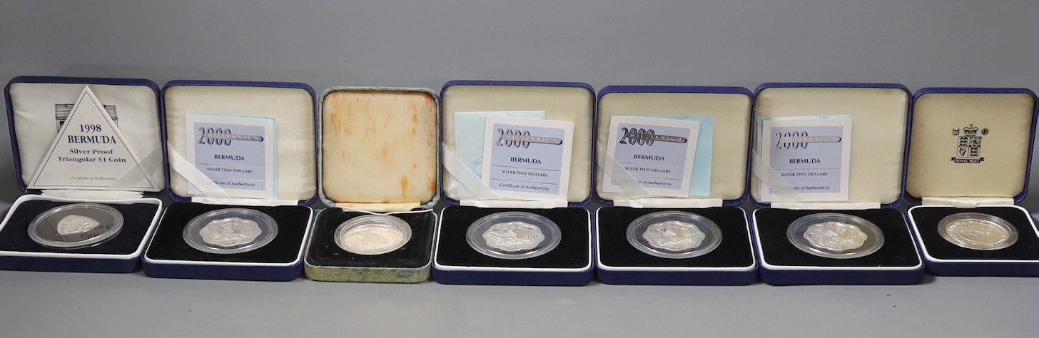 A group of boxed Bermuda silver coins